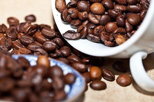 Coffe Beans on a Table and in a Cup