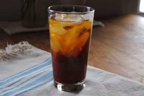 Glass on a table full of Cold Brew Coffee