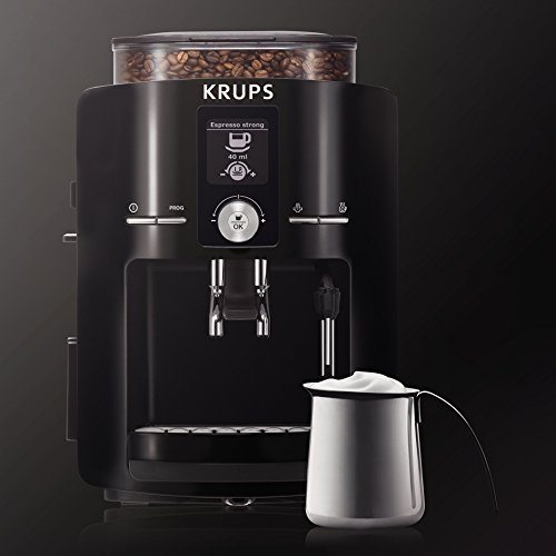 Krups EA8250 Espresseria Fully Automatic Espresso Machine Coffee Maker with Cream Next to it