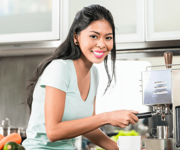 Girl Using Home Espresso Machine