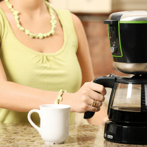 Woman Using A Drip Coffee Maker