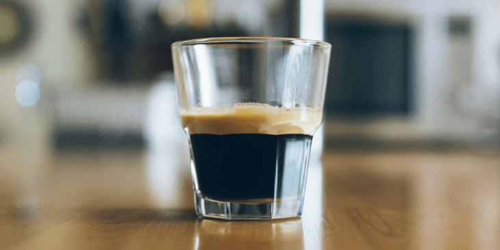 A Glass On Counter With The Perfect Espresso Coffee 