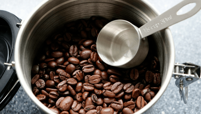 Coffee Beans In Container With Scoop