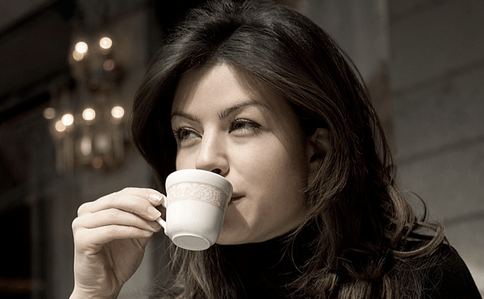 Woman Drinking a Cup of Espresso  