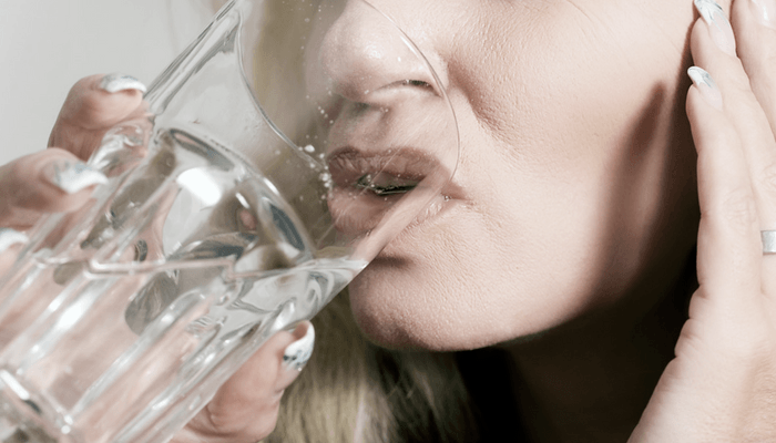 Girl Drinking A Glass Of Water