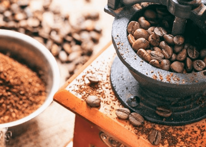 Coffee Grinder With Beans And Ground Coffee