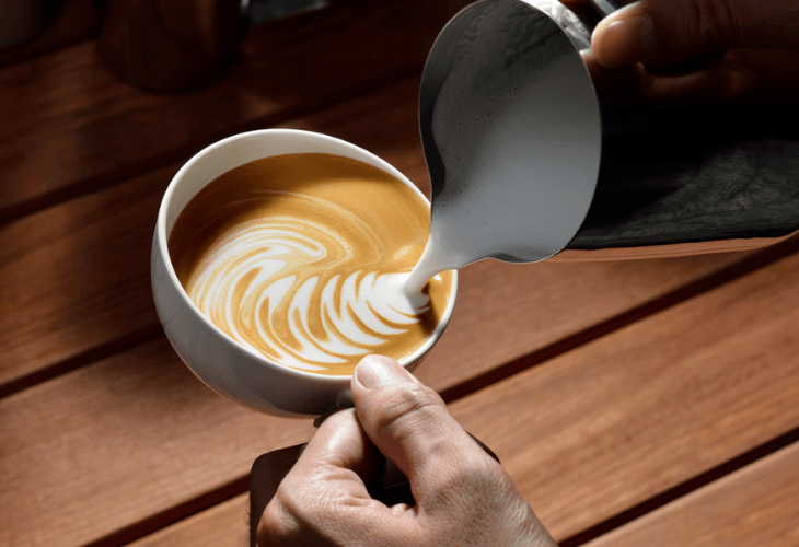 Pouring Froth For Cappuccino Into Cup