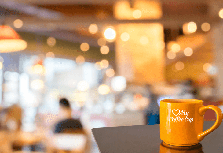 Empty Wood Table With Coffee Shop Blurred Background