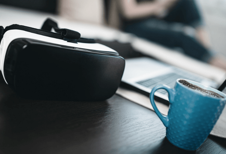 Virtual reality glasses and a cup of coffee