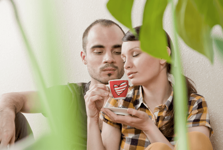 Young loving couple using coffee as an aphrodisiac