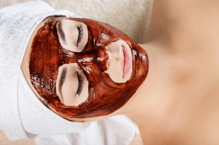 Woman with a honey and coffee mask on her face