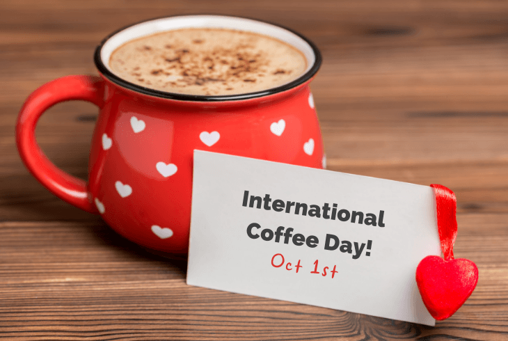 International coffee day sign with a red cup