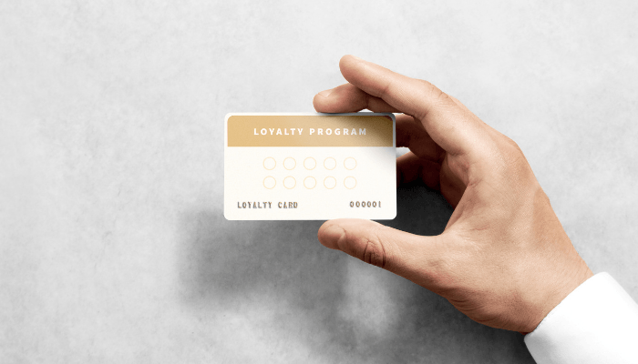 Hand holding a program loyalty card