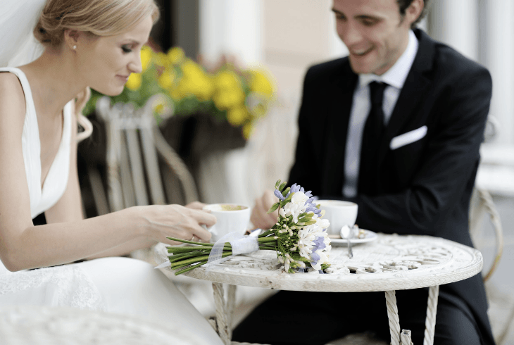 Bride and Groom drinking espresso at their wedding