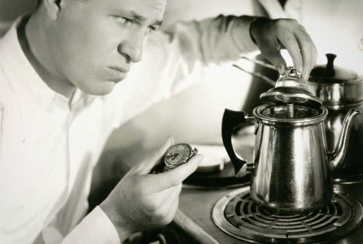 Man making coffee in a stovetop percolator