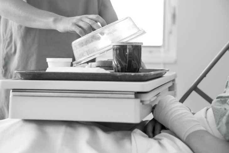 Patient getting his first cup of coffee after surgery  