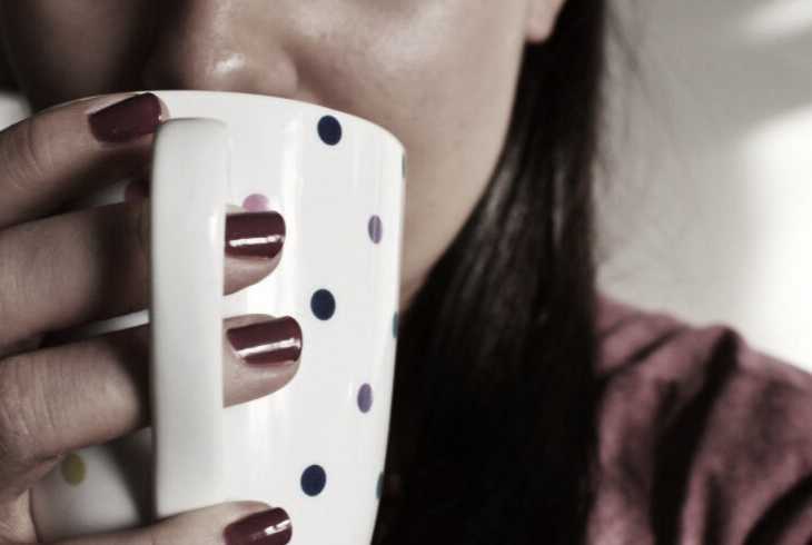 Young woman sipping her morning joe