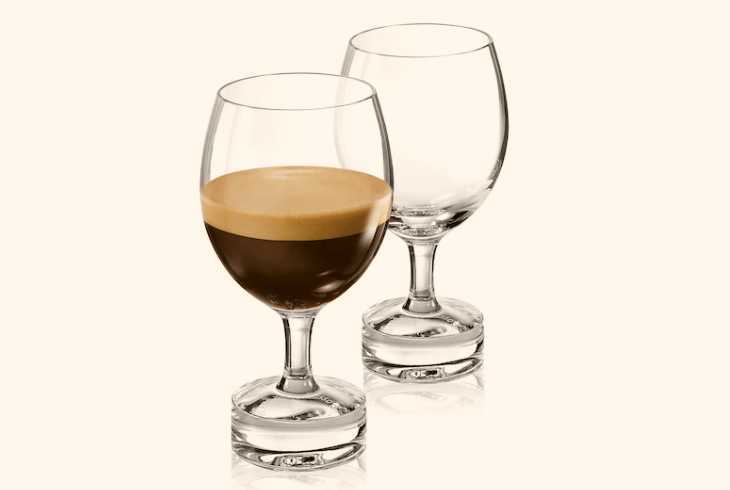 Two espresso glasses on white background