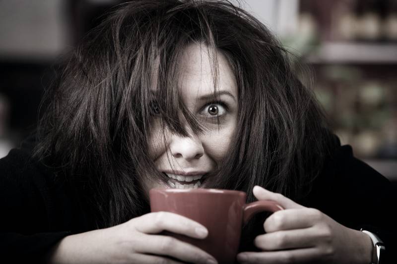 Woman suffering the negative effects of caffeine